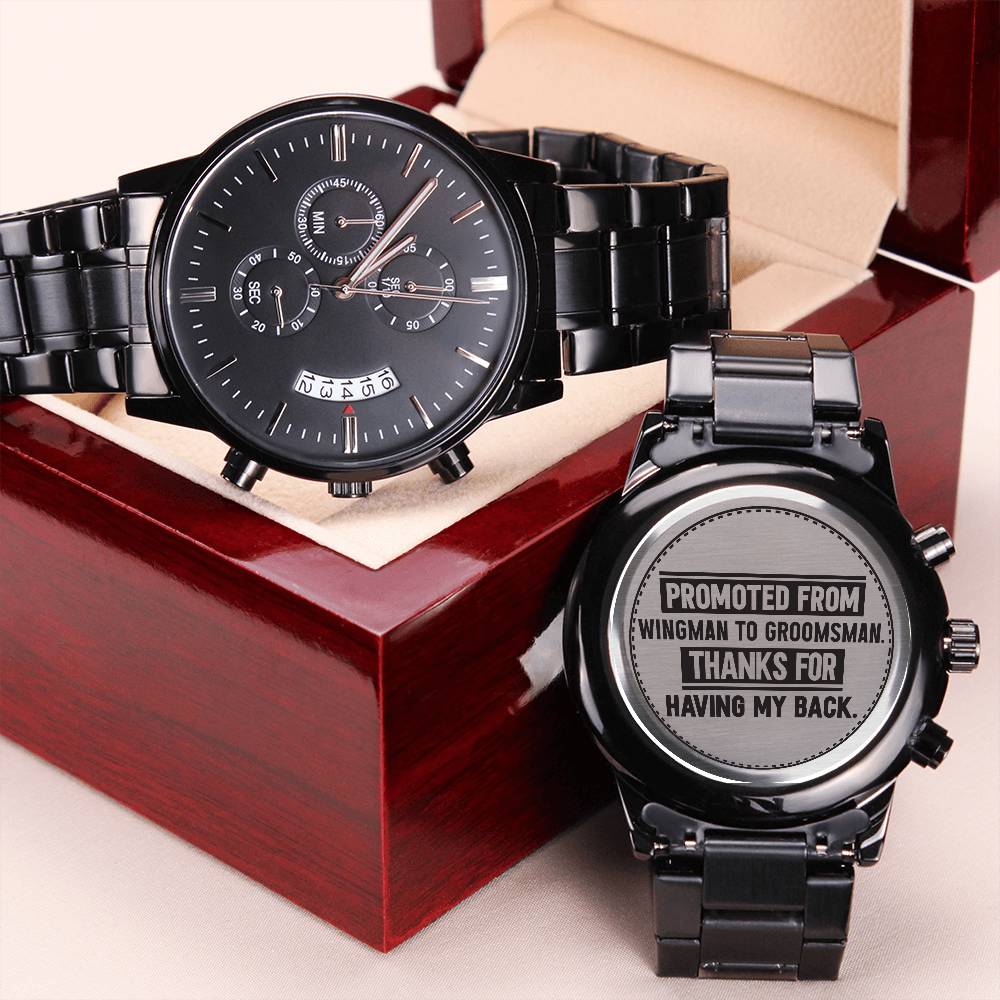 Two black metal watches in a wood box; one back engraved Promoted From Wingman to Groomsman Thanks For Having My Back.